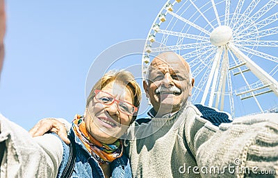 Happy retired senior couple taking selfie at winter travel trip Stock Photo