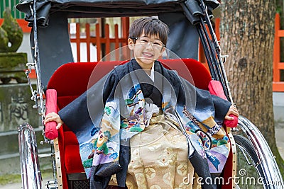 Happy Rickshaw Boy in Kimono Stock Photo