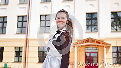 Happy russian female graduate posing on her graduation day. Stock Photo