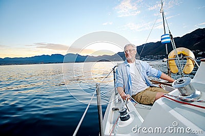 Happy sailing man boat Stock Photo