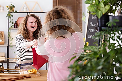 Happy saleswoman selling skincare products Stock Photo