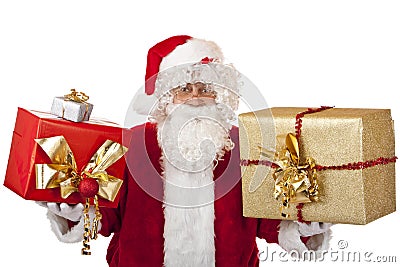 Happy Santa Claus holding Christmas gifts in hands Stock Photo