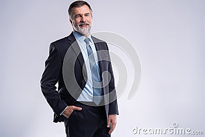 Happy satisfied mature businessman looking at camera isolated on white background. Stock Photo