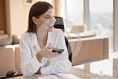 Happy satisfied young smartphone user woman holding gadget Stock Photo