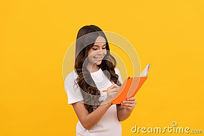 happy school child ready to study making notes in notepad, school Stock Photo