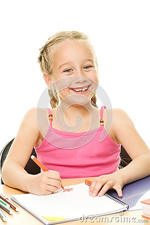 Happy schoolgirl drawing Stock Photo