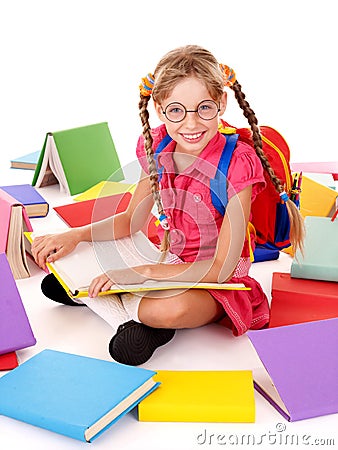 Happy schoolgirl in eyeglasses with pile of books. Stock Photo