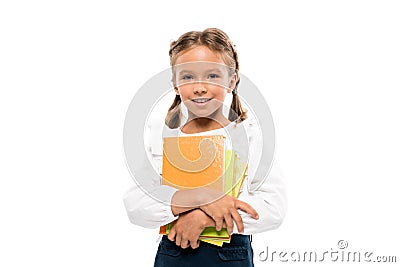 happy schoolkid holding books isolated on white . Stock Photo