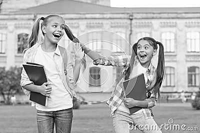 Happy schoolmates. School camp. Modern education. Teens with backpacks. Girls school background. STEM summer camps and Stock Photo