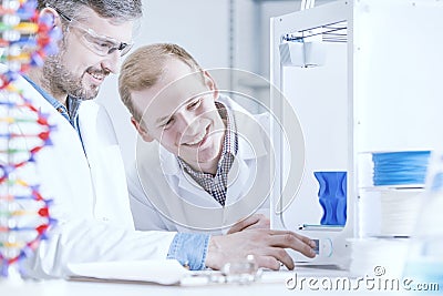 Happy scientist working at laboratory Stock Photo