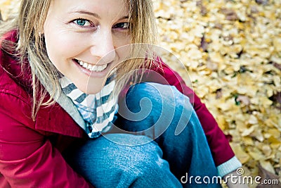 Happy Seated Woman Stock Photo