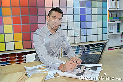 Happy seller assistant man in diy hardware store Stock Photo