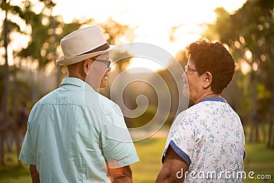 A happy senior couple asian old man and woman smiling and laughing in the garden, happy marriage. Senior healthcare and Stock Photo