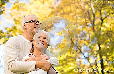 Happy senior couple in autumn park Stock Photo