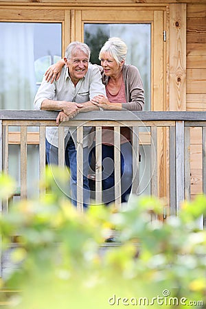 Happy senior couple in cabin enjoying Stock Photo