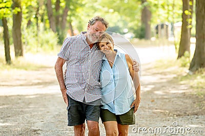 Happy senior couple walking and enjoying life outdoors Stock Photo