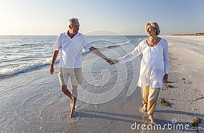 Happy Senior Couple Walking Holding Hands Tropical Beach Stock Photo