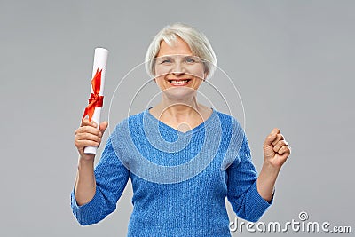 Happy senior graduate student woman with diploma Stock Photo