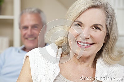 Happy Senior Man & Woman Couple Smiling at Home Stock Photo