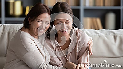 Happy senior mother and grownup daughter enjoy weekend at home Stock Photo