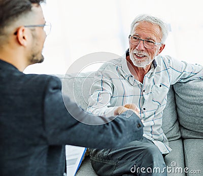 handshake senior couple investment business finance hand agent meeting agreement planning home Stock Photo
