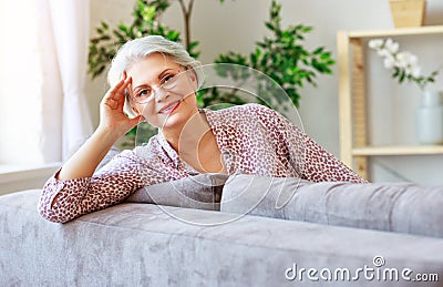 Happy senior old woman smiling at home Stock Photo