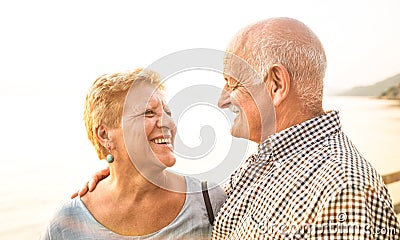 Happy senior retired couple having fun outdoors at travel vacation Stock Photo