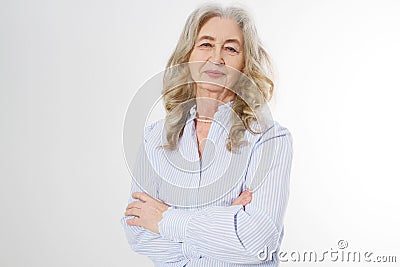 Happy senior woman with crossed arms on white background. Positive elderly seniors life living and european old beauty Stock Photo