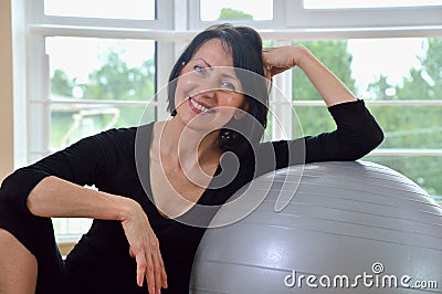 Happy senior woman resting after exercise Stock Photo