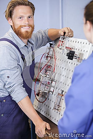 happy service man repairs electronics Stock Photo