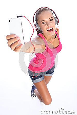 Happy teenage girl has music fun with phone Stock Photo