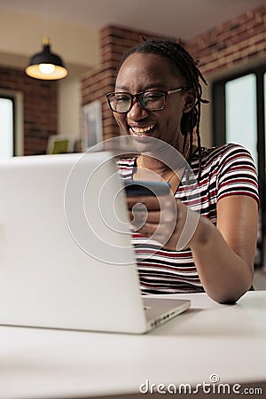 Happy shopaholic making purchase in internet store sale Stock Photo