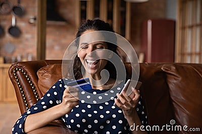 Happy shopaholic woman excited with buying good on internet stores Stock Photo