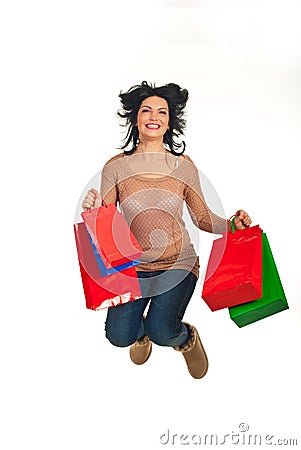 Happy shopper woman jumping Stock Photo