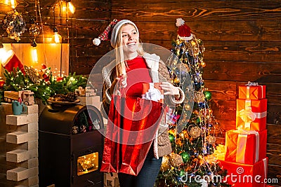 Happy shopping. Noel. Girl enjoy cozy atmosphere christmas eve. Pleasant moments. Christmas joy. Woman wooden interior Stock Photo