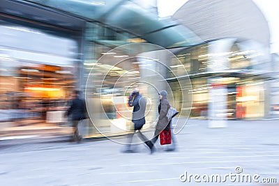 Happy shopping, people walking, motion blur Editorial Stock Photo