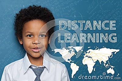 Happy smart African American child boy on blue background Stock Photo