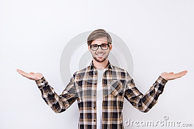 Happy smart young worker in glasses making presentation of two different options Stock Photo