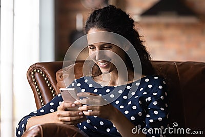 Happy smartphone user getting message with good news Stock Photo