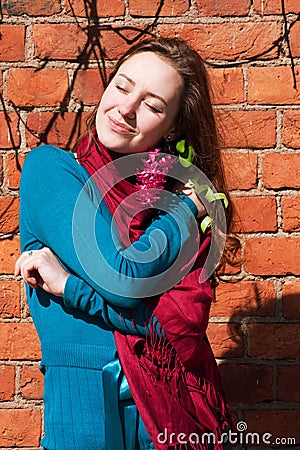 Happy smile girl with lilac recieved from lover Stock Photo