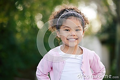 Happy, smile and portrait of a kid in a garden with joy, positive emotion and childhood growth. Happiness, excited girl Stock Photo