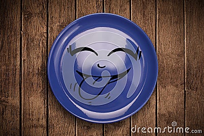 Happy smiley cartoon face on colorful dish plate Stock Photo