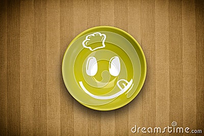 Happy smiley cartoon face on colorful dish plate Stock Photo