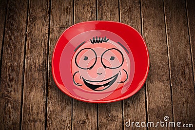 Happy smiley cartoon face on colorful dish plate Stock Photo