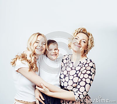 Happy smiling blond family together posing cheerful on white bac Stock Photo