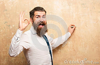 Happy smiling business man draw on wall. Businessman writing with marker. Creative man drawing, template. Stock Photo