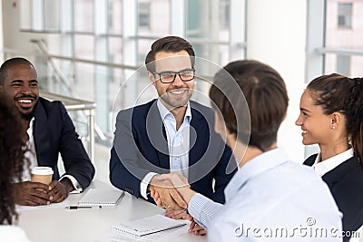 Happy smiling businessman handshake with business partner for successful agreement Stock Photo