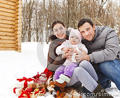 Happy smiling family with at the winter picnic Stock Photo