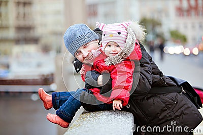 Happy smiling father and daughter in the background of city lights Stock Photo