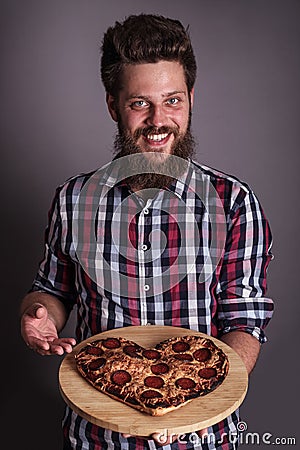 Man gives heart shapes pizza Stock Photo